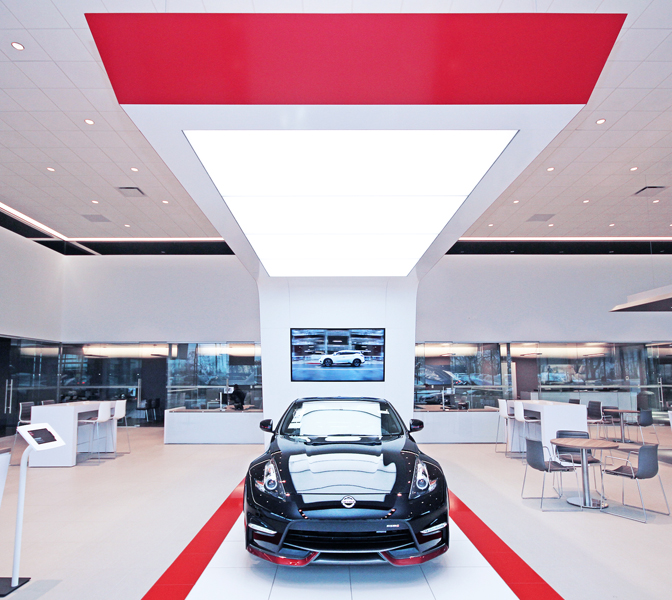 Car runway in Nissan dealership with seating area