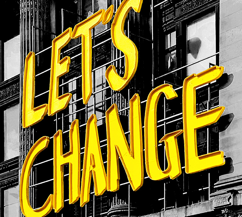 Yellow sign that says "Let's Change"